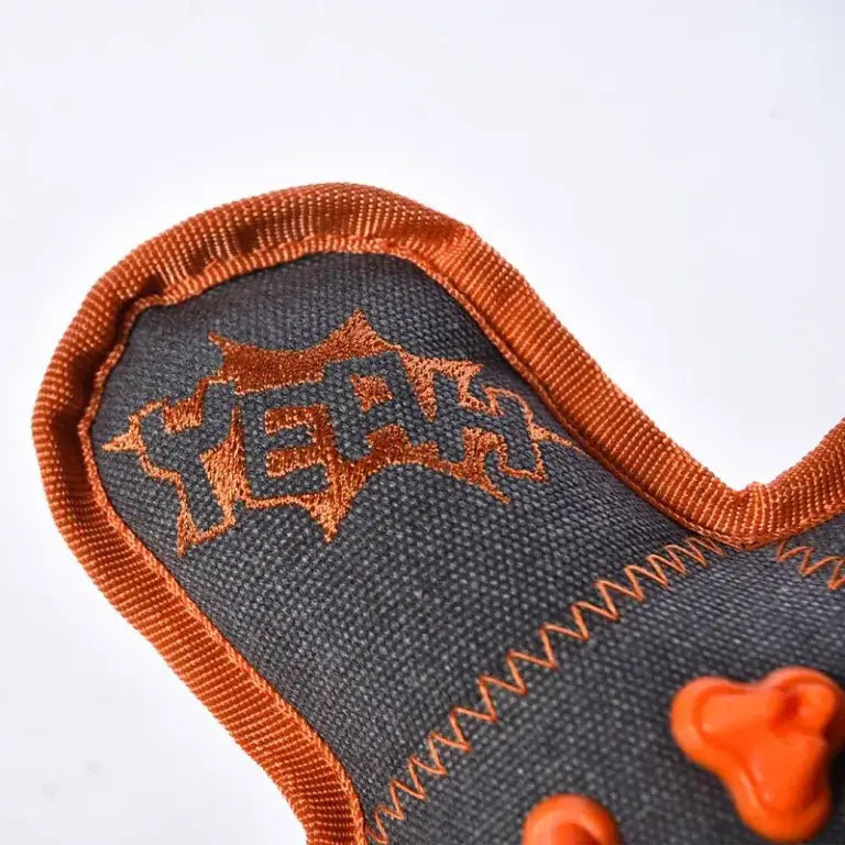 Close-up of soft plush fabric on squeaky dog toy for gentle pla