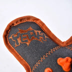 Close-up of soft plush fabric on squeaky dog toy for gentle pla