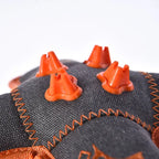 Top view of squeaky teeth cleaning dog toy with rubber and plush